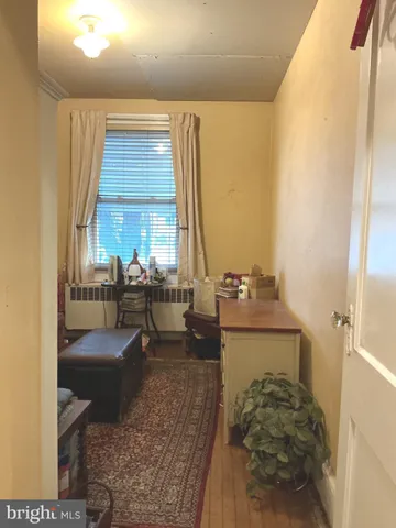 a en suite bathroom with a toilet sink and mirror