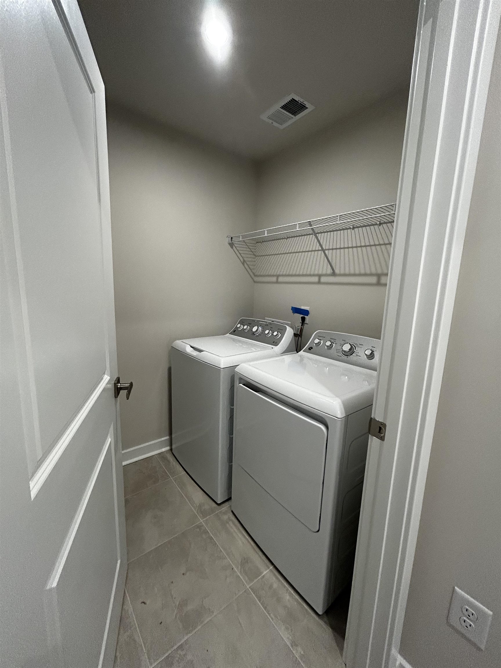 1301 Pleasant View Drive, Unit A North Myrtle Beach, SC 29582 - Photo 12 of 13 Washroom with washing machine and dryer and light tile patterned floors