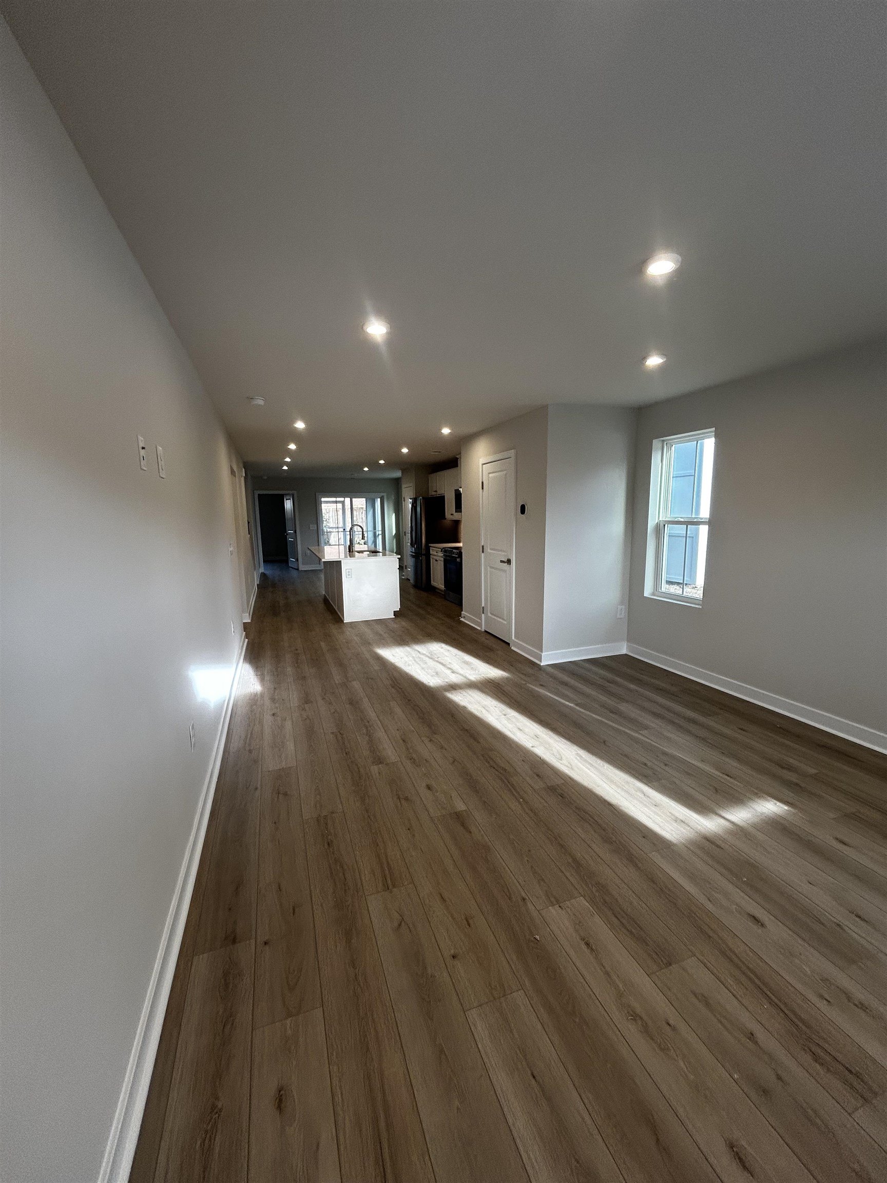 1301 Pleasant View Drive, Unit A North Myrtle Beach, SC 29582 - Photo 2 of 13 Unfurnished living room with dark wood-style flooring and recessed lighting