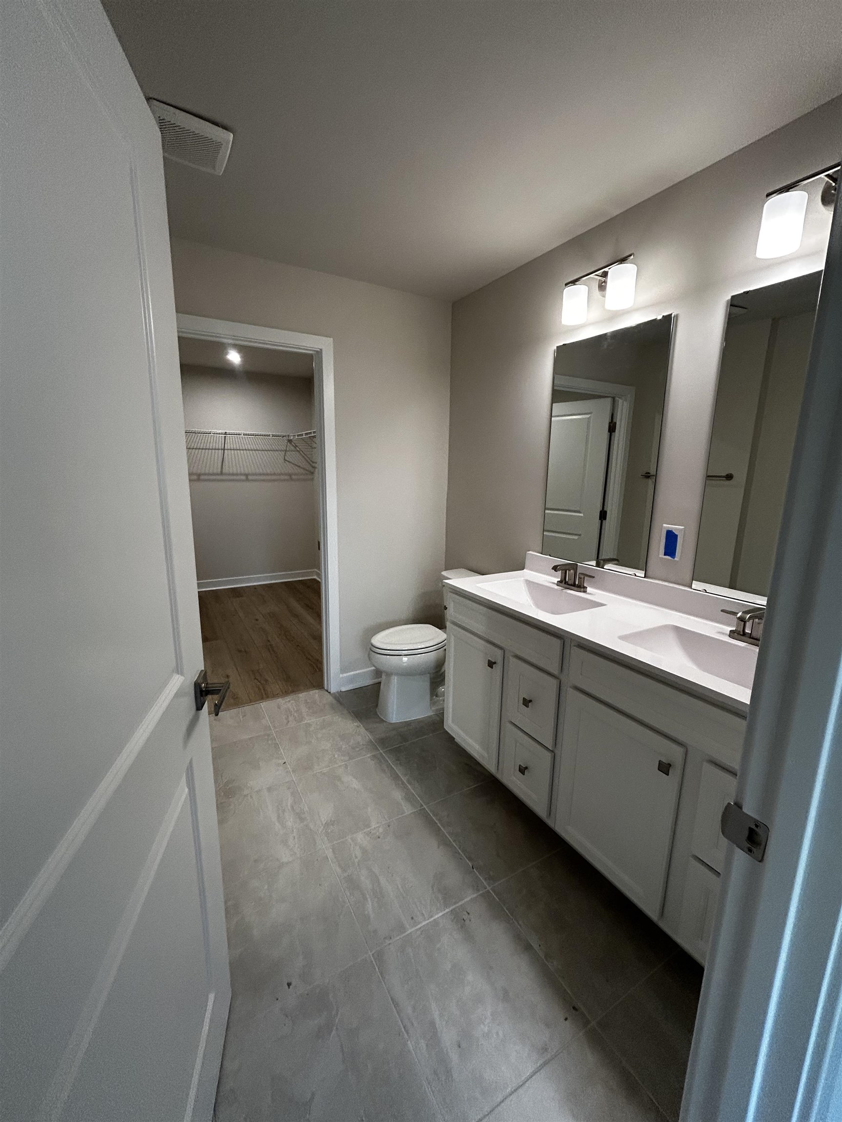 1301 Pleasant View Drive, Unit A North Myrtle Beach, SC 29582 - Photo 6 of 13 Full bathroom featuring a walk in closet and double vanity