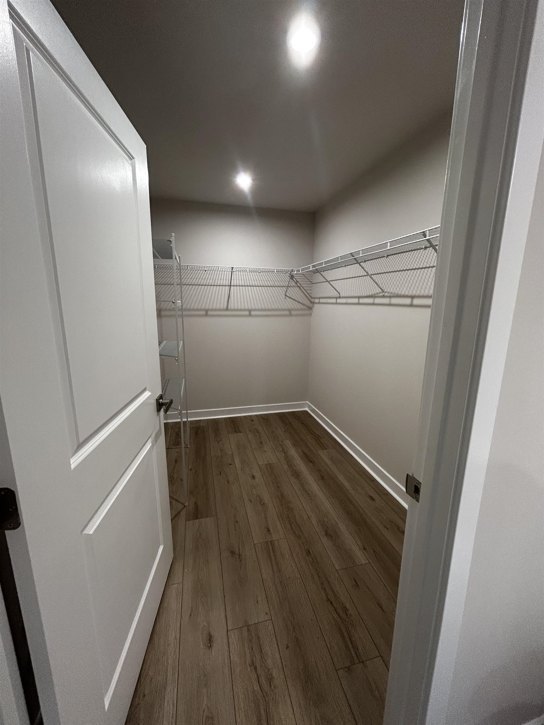 1301 Pleasant View Drive, Unit A North Myrtle Beach, SC 29582 - Photo 8 of 13 Spacious closet featuring dark wood-type flooring