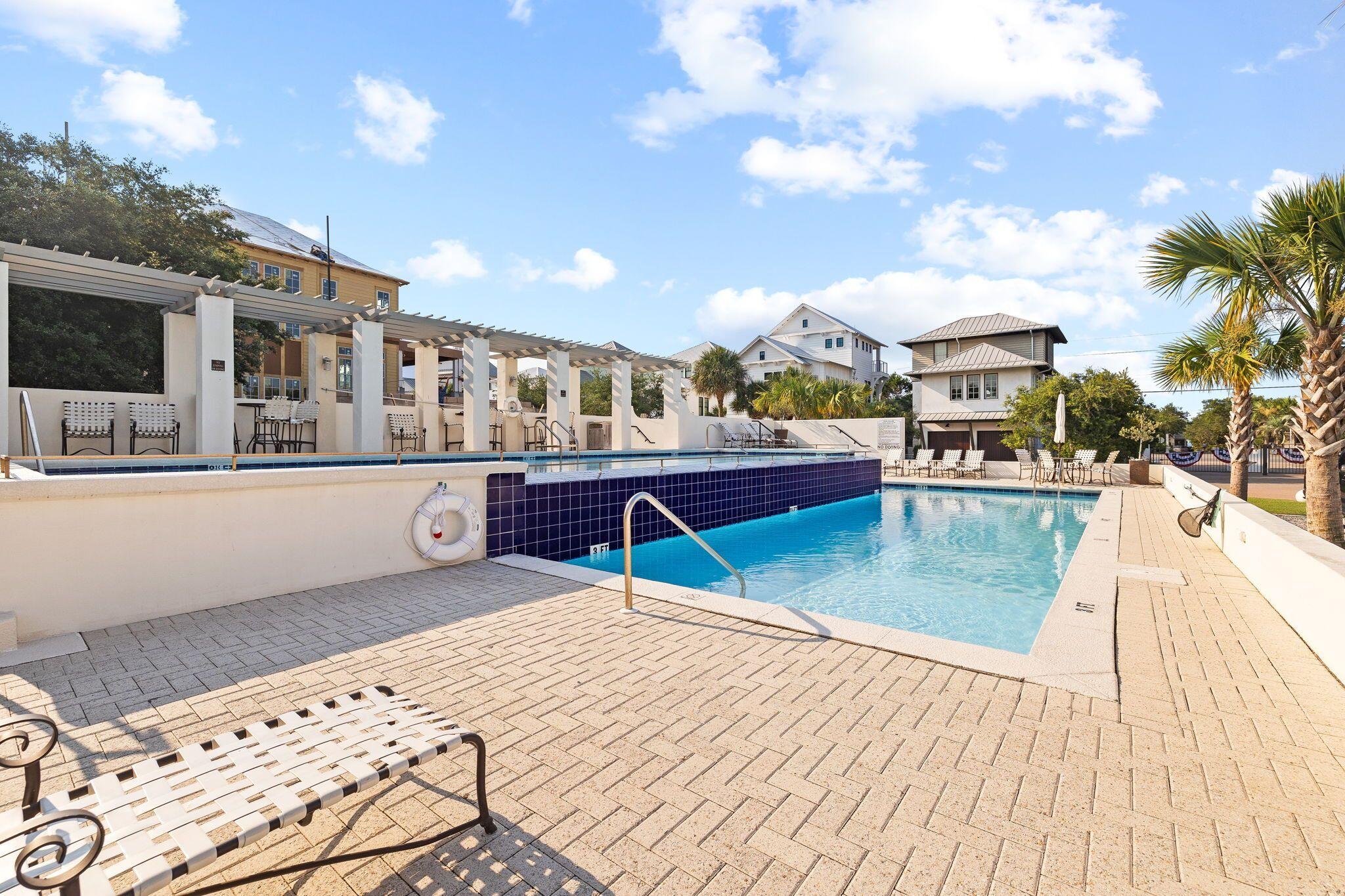 15 Sand Oaks Circle Santa Rosa Beach, FL 32459 - Photo 13 of 18 a swimming pool with a yard and plants