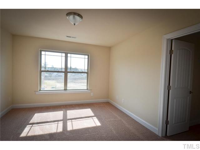 117 Weathers Street Rolesville, NC 27571 - Photo 15 of 16 Additional secondary bedroom with walk-in closet.