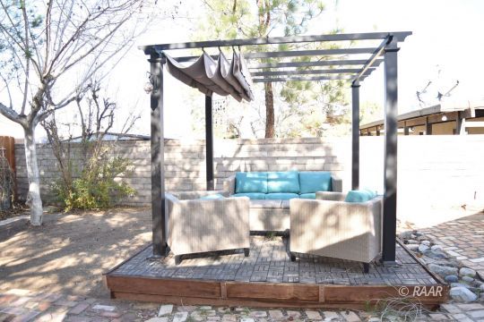 313 South Lilac Street Ridgecrest, CA 93555 - Photo 23 of 26 a view of a porch with a floor to ceiling windows
