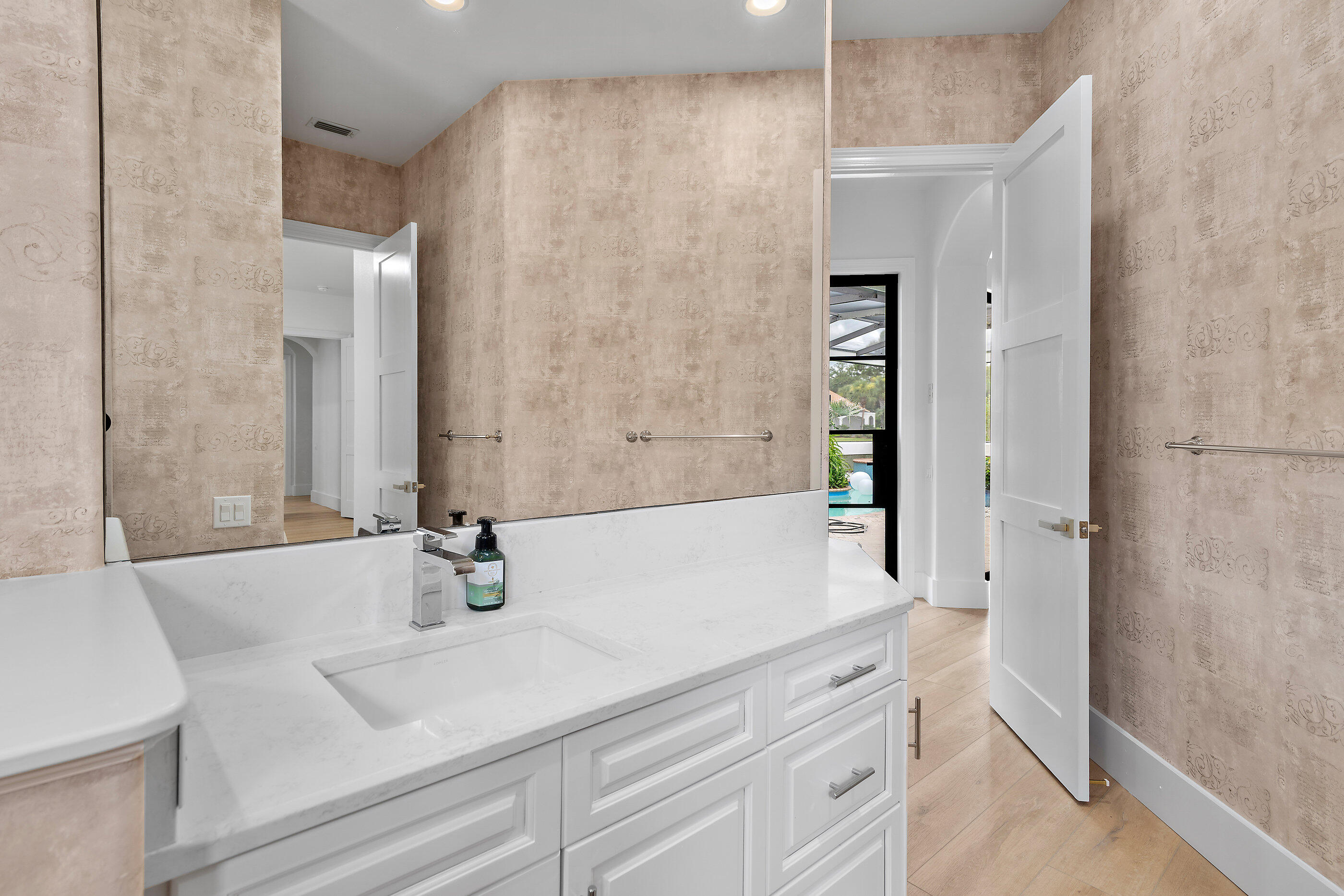 465 Captains Circle Destin, FL 32541 - Photo 46 of 59 a bathroom with a sink and a mirror