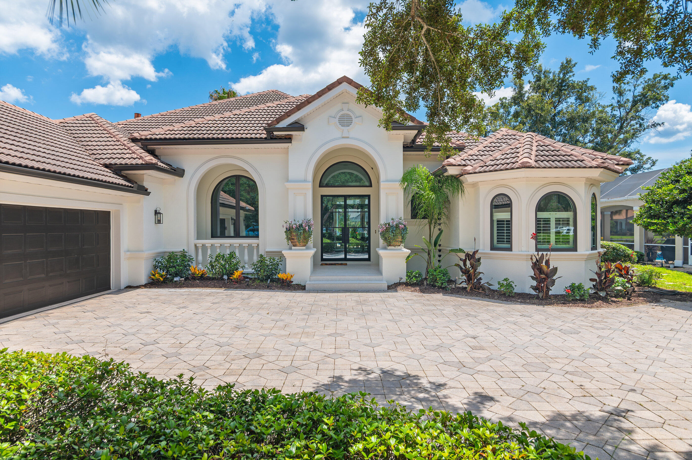 465 Captains Circle Destin, FL 32541 - Photo 56 of 59 a front view of a house with a garden