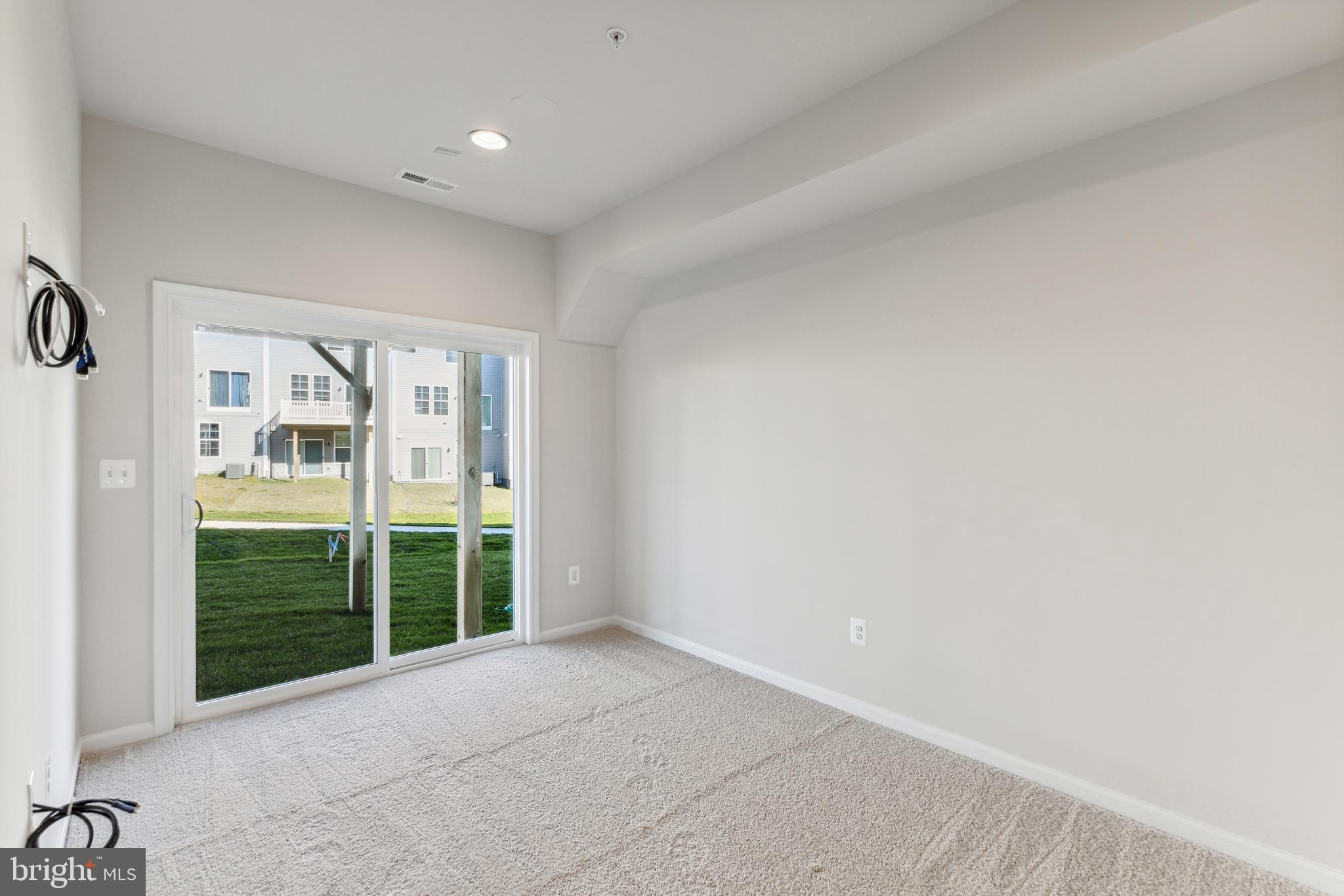 1036 Highpoint Trail Laurel, MD 20707 - Photo 15 of 28 a view of an empty room with a sliding door