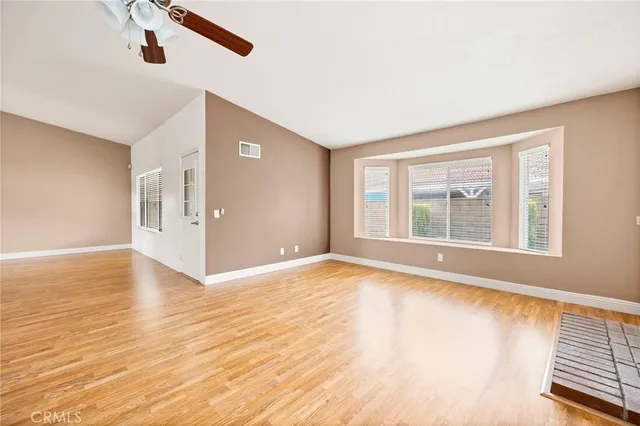 a view of a kitchen with wooden floor