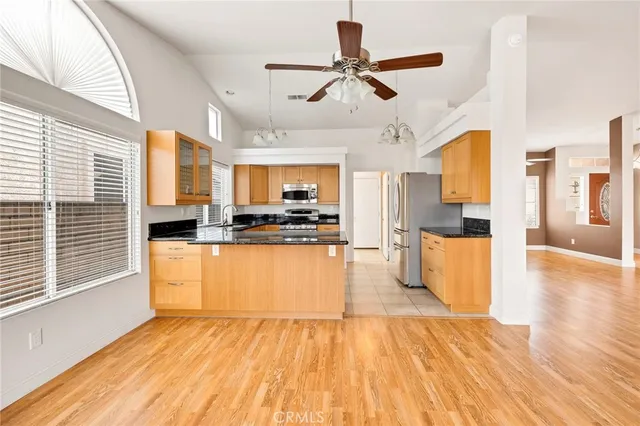 a view of a kitchen with a sink and a fireplace