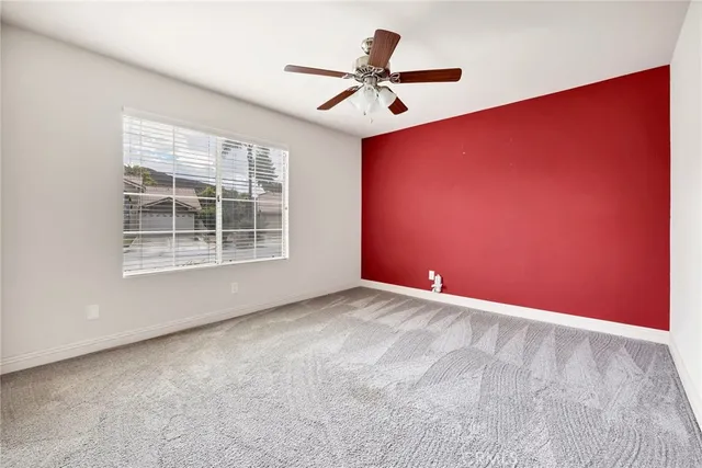a bathroom with a sink vanity mirror and toilet