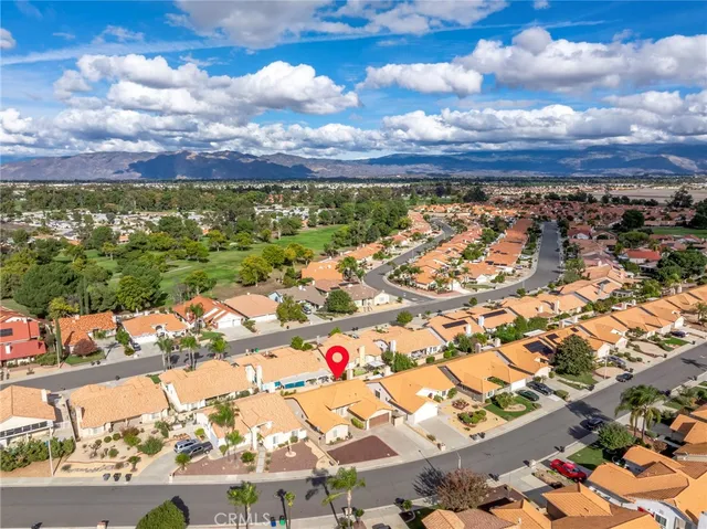 an aerial view of residential building and car parked