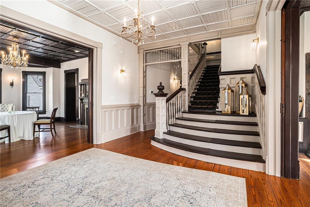 410 East Church Street Monroe, GA 30655 - Photo 2 of 50 a view of entryway and hall with wooden floor