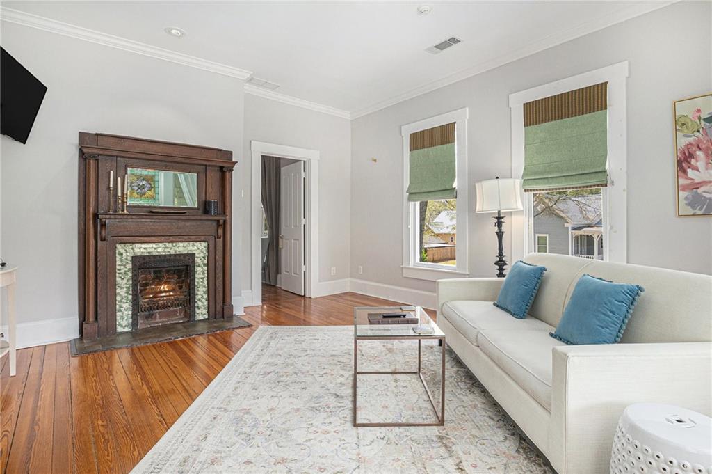 410 East Church Street Monroe, GA 30655 - Photo 21 of 50 a living room with furniture and a fireplace
