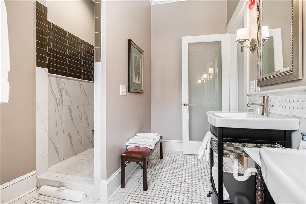 410 East Church Street Monroe, GA 30655 - Photo 28 of 50 a bathroom with a sink toilet and shower