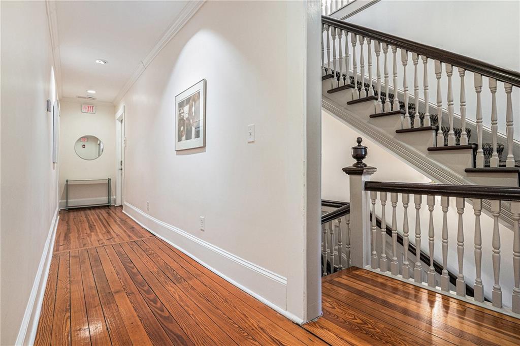 410 East Church Street Monroe, GA 30655 - Photo 29 of 50 a view of a hallway with wooden floor and staircase