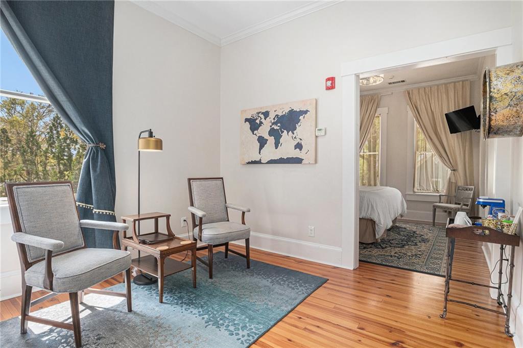 410 East Church Street Monroe, GA 30655 - Photo 30 of 50 a living room with furniture and wooden floor