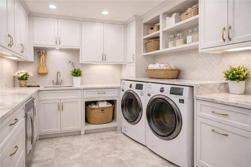 410 East Church Street Monroe, GA 30655 - Photo 34 of 50 a kitchen with a stove top oven sink and cabinets