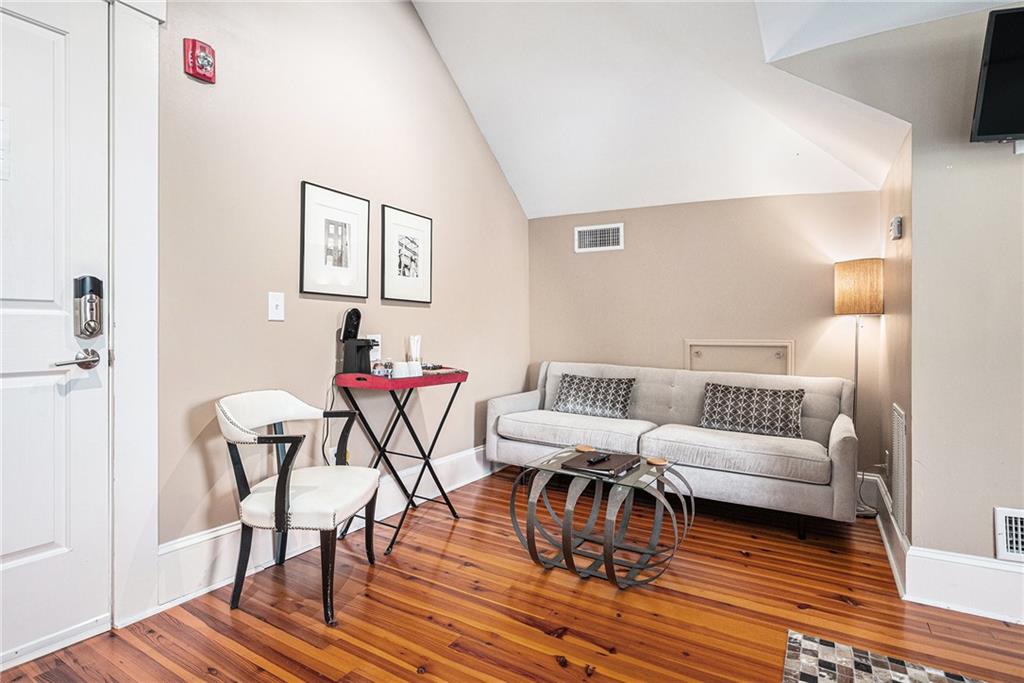 410 East Church Street Monroe, GA 30655 - Photo 35 of 50 a living room with furniture and a wooden floor