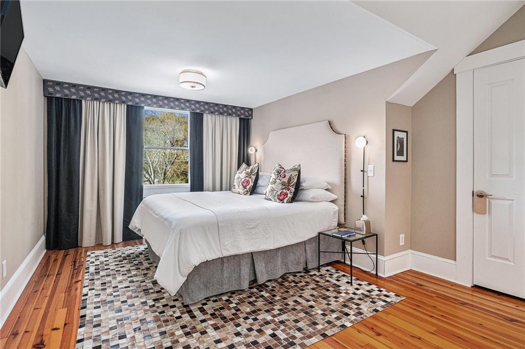 410 East Church Street Monroe, GA 30655 - Photo 36 of 50 a bedroom with a bed and a window