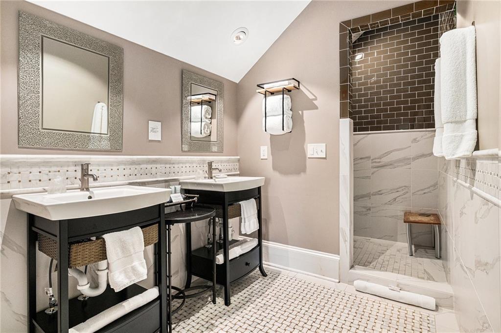 410 East Church Street Monroe, GA 30655 - Photo 37 of 50 a bathroom with a sink and a mirror