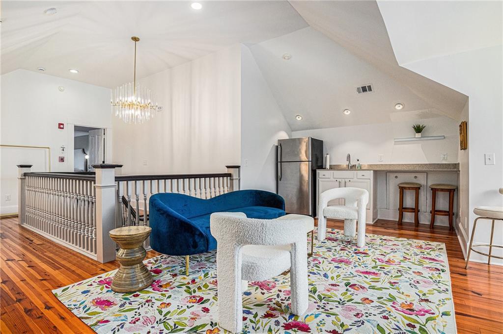 410 East Church Street Monroe, GA 30655 - Photo 38 of 50 a living room with furniture and kitchen view