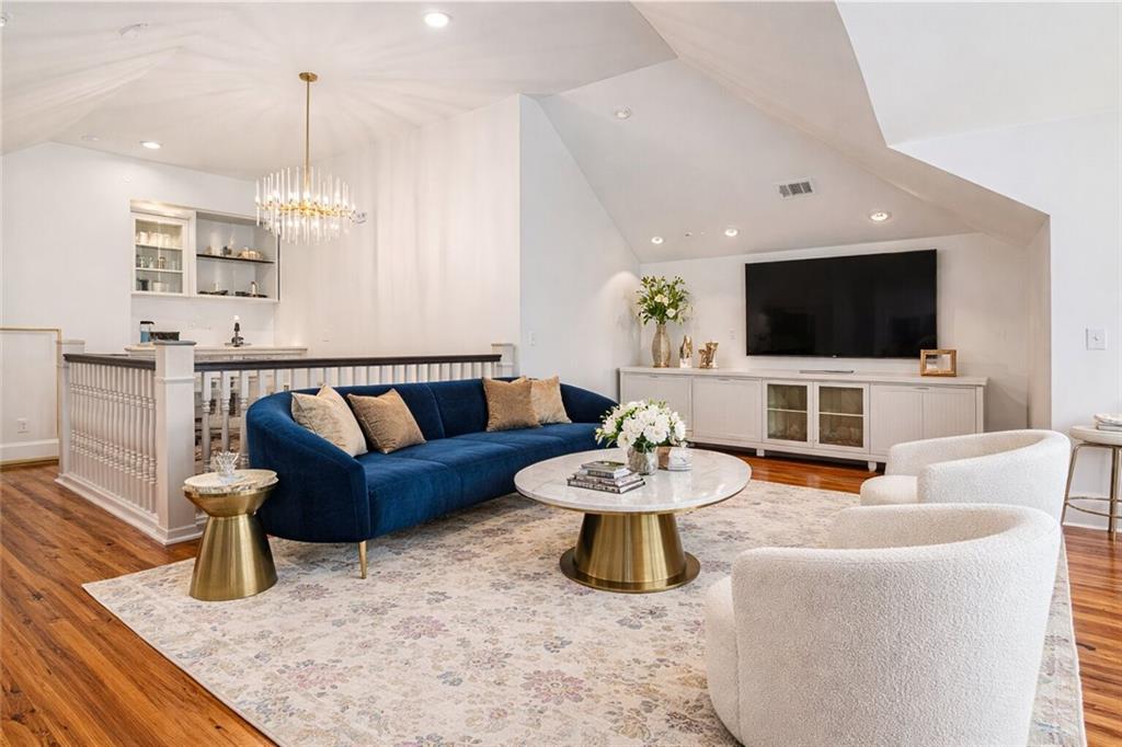 410 East Church Street Monroe, GA 30655 - Photo 39 of 50 a living room with furniture and a flat screen tv