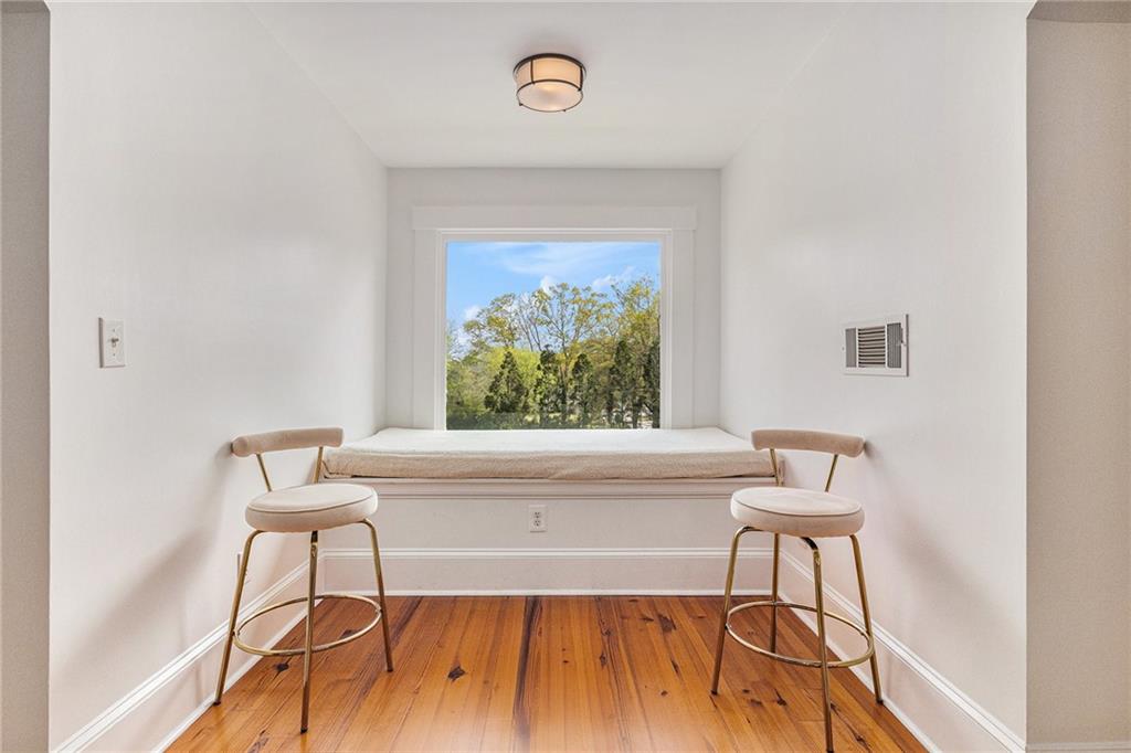 410 East Church Street Monroe, GA 30655 - Photo 40 of 50 a living room with a rug and a painting on the wall