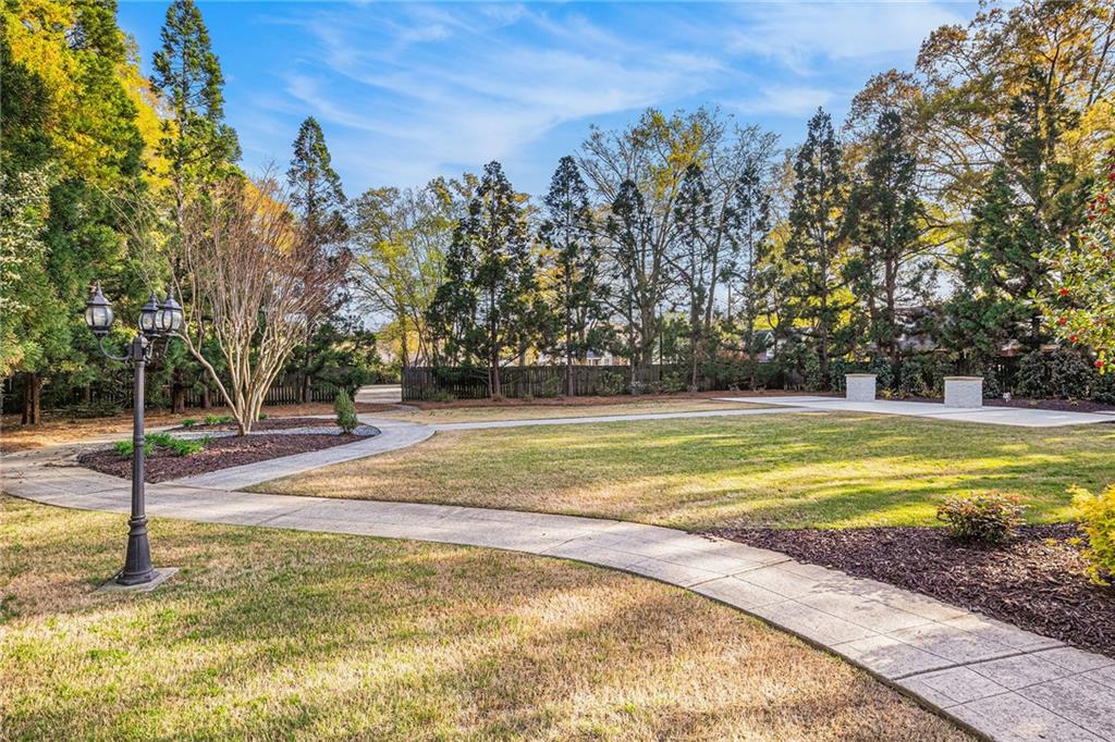 410 East Church Street Monroe, GA 30655 - Photo 46 of 50 a view of a swimming pool with an outdoor space and seating area