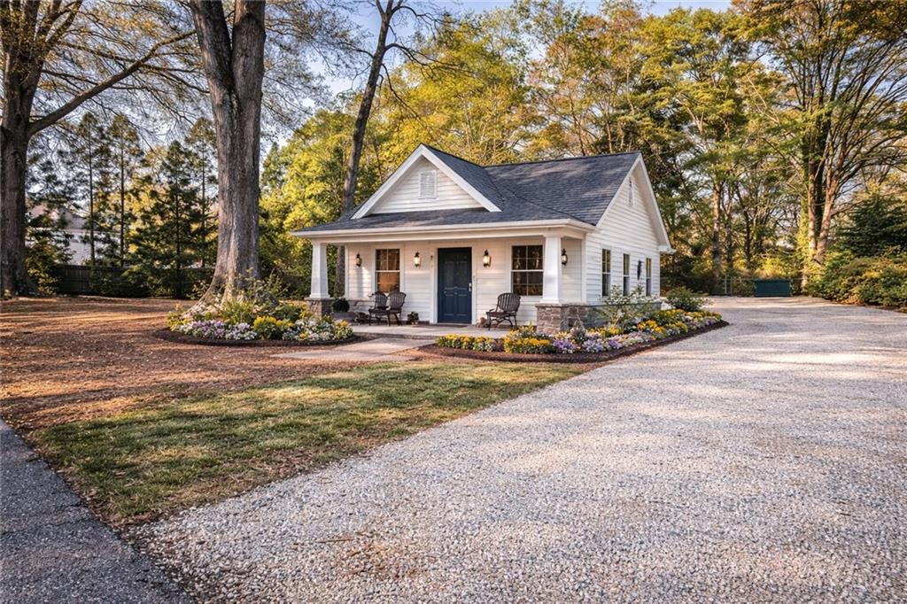 410 East Church Street Monroe, GA 30655 - Photo 49 of 50 a view of a house with sitting area and swimming pool