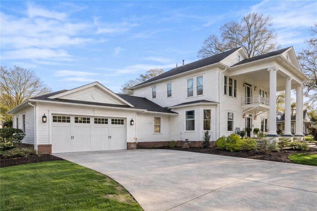 410 East Church Street Monroe, GA 30655 - Photo 50 of 50 a view of a white house with a big yard and large trees