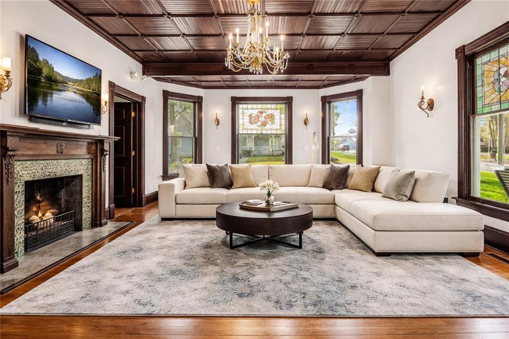 410 East Church Street Monroe, GA 30655 - Photo 5 of 50 a living room with furniture a fireplace and a flat screen tv