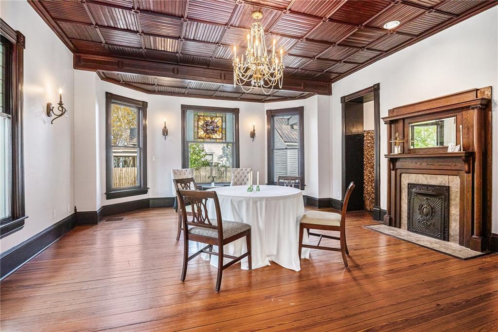 410 East Church Street Monroe, GA 30655 - Photo 6 of 50 a view of a dining room with furniture window and wooden floor