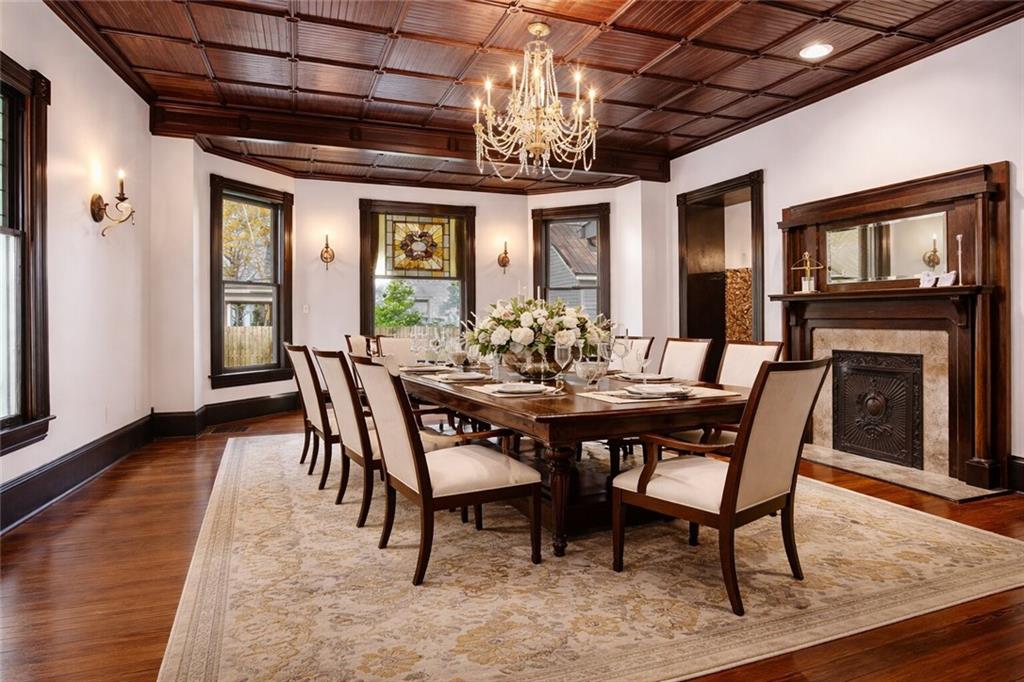 410 East Church Street Monroe, GA 30655 - Photo 7 of 50 a view of a dining room with furniture wooden floor and chandelier