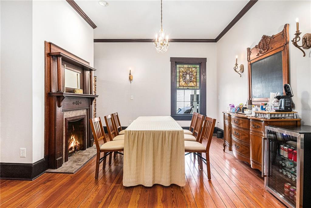 410 East Church Street Monroe, GA 30655 - Photo 8 of 50 a view of a dining room with furniture and wooden floor