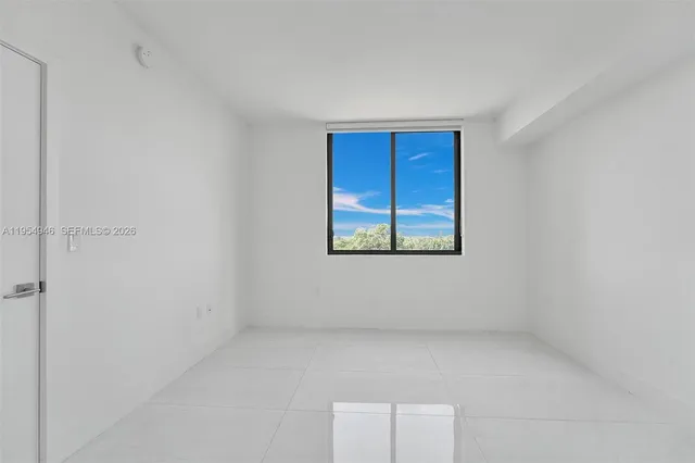 a bathroom with a sink a large mirror and shower