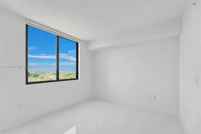 a bathroom with a sink a large mirror and shower