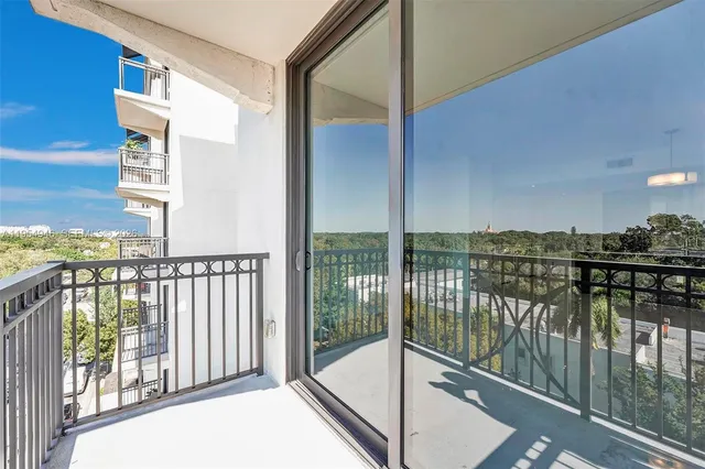 a view of a patio with couches and a fire pit