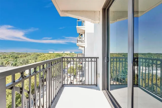 a view of a building with sitting area