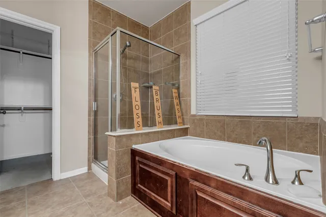 a bathroom with a double vanity sink and mirror