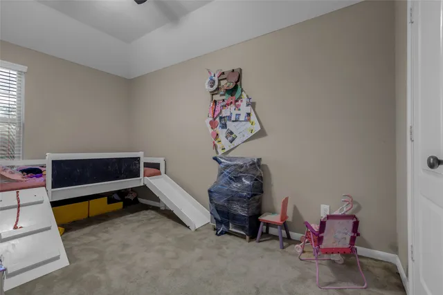 a view of yard with swimming pool and sitting area