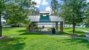 a view of a swimming pool with a bench and floor to ceiling window