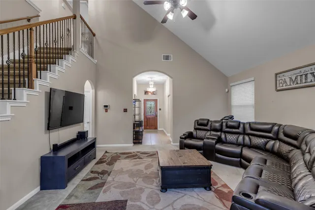 a living room with furniture and a flat screen tv