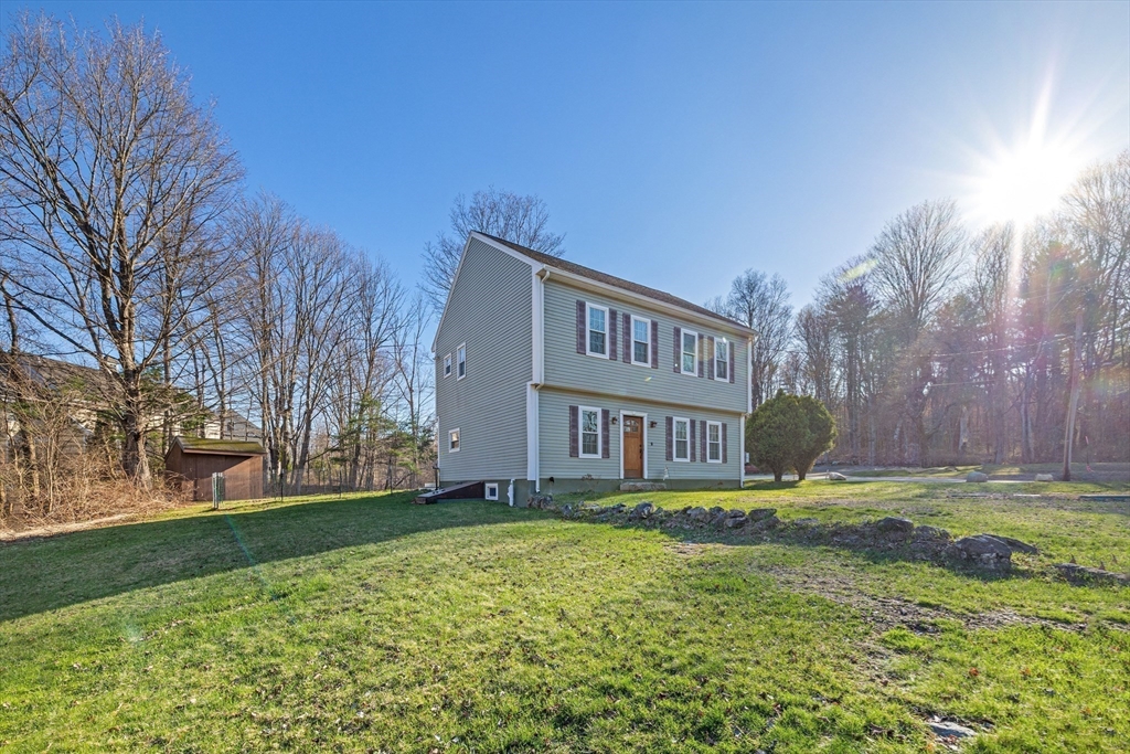 38 Brook Street Georgetown, MA 01833 - Photo 4 of 42 a view of a house with a yard