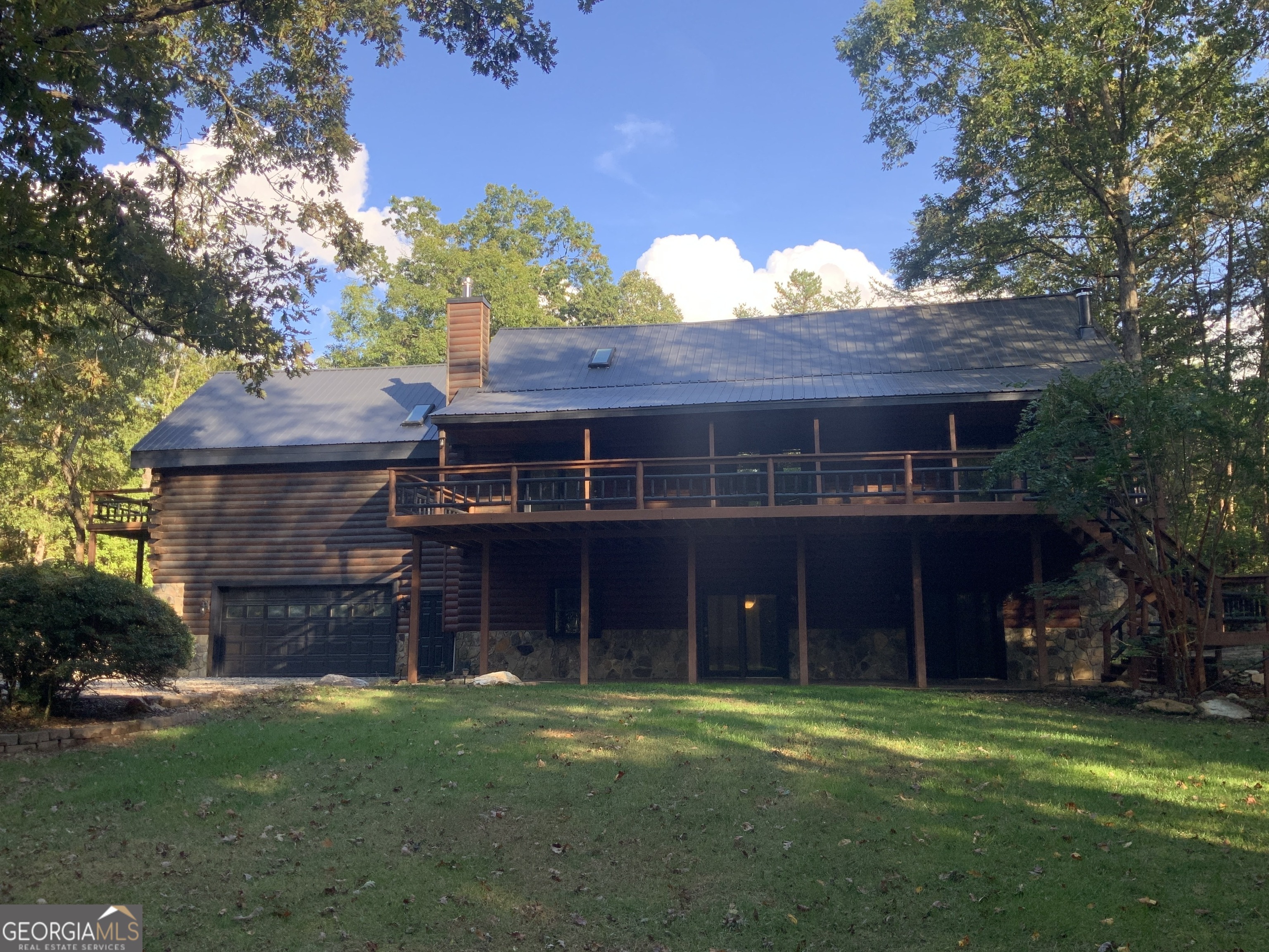 11 Foxfire Road Blairsville, GA 30512 - Photo 2 of 60 a front view of a house with a garden