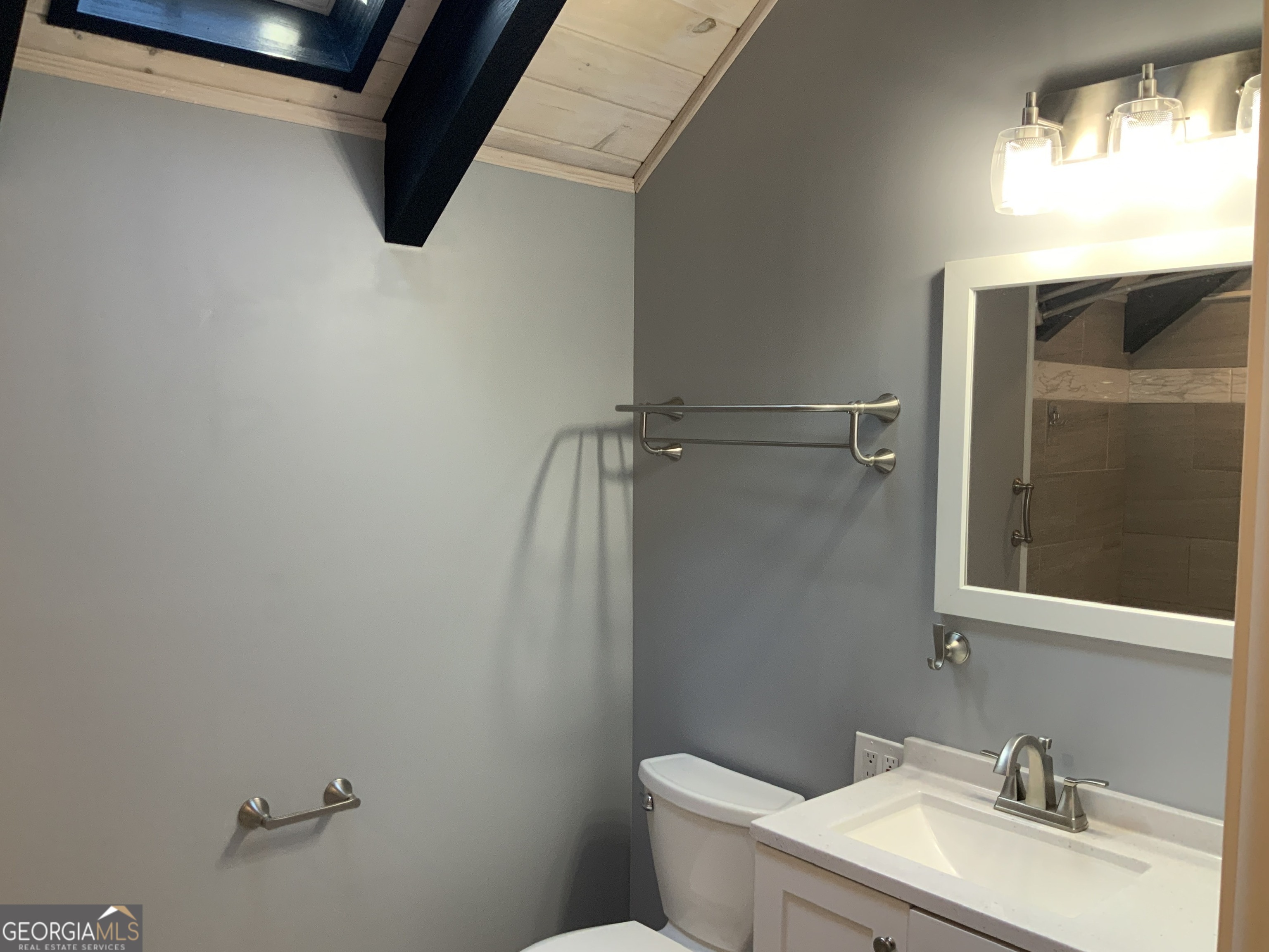 11 Foxfire Road Blairsville, GA 30512 - Photo 23 of 60 a bathroom with a granite countertop sink toilet and vanity