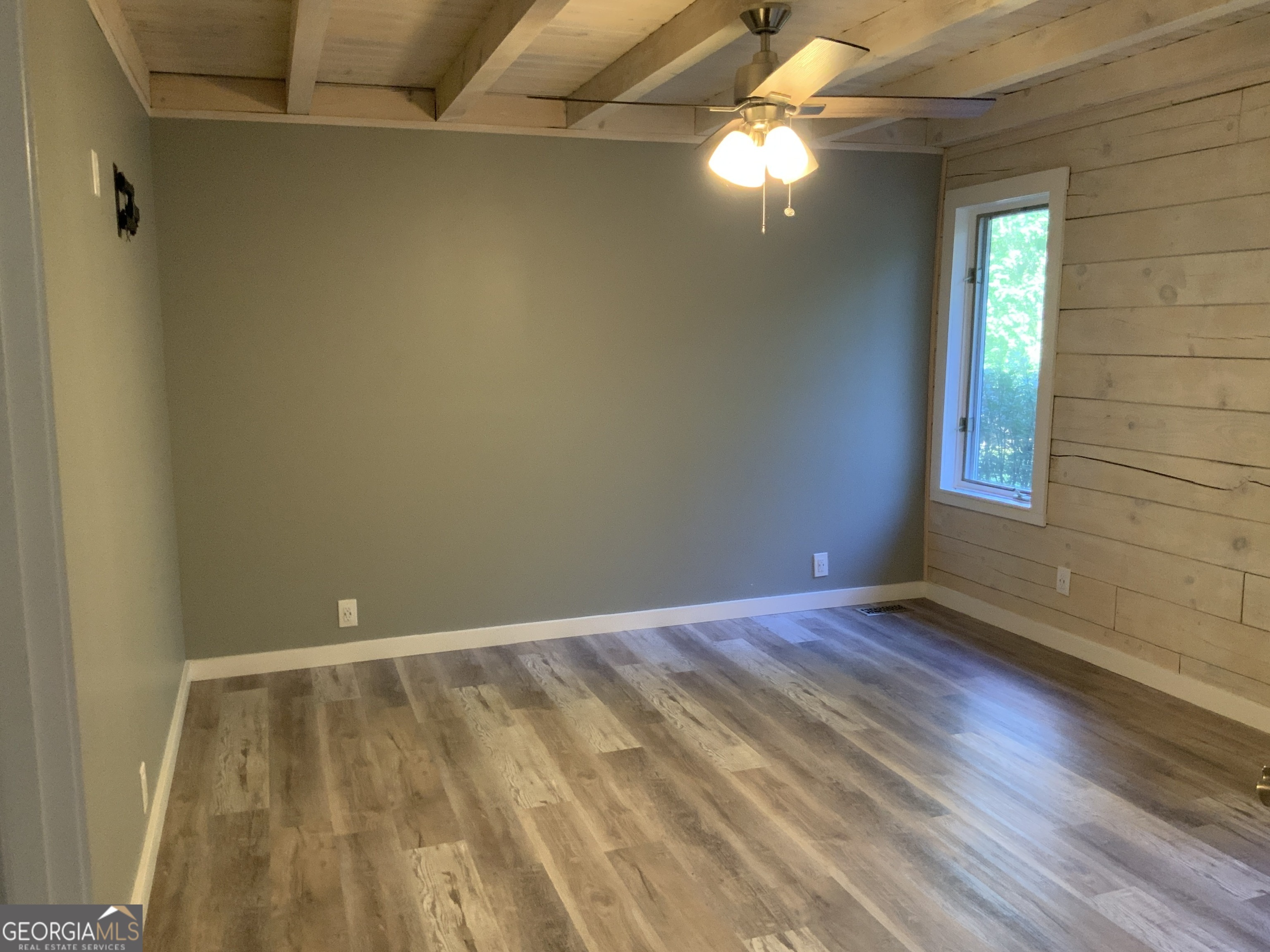 11 Foxfire Road Blairsville, GA 30512 - Photo 35 of 60 a view of an empty room with window and chandelier fan