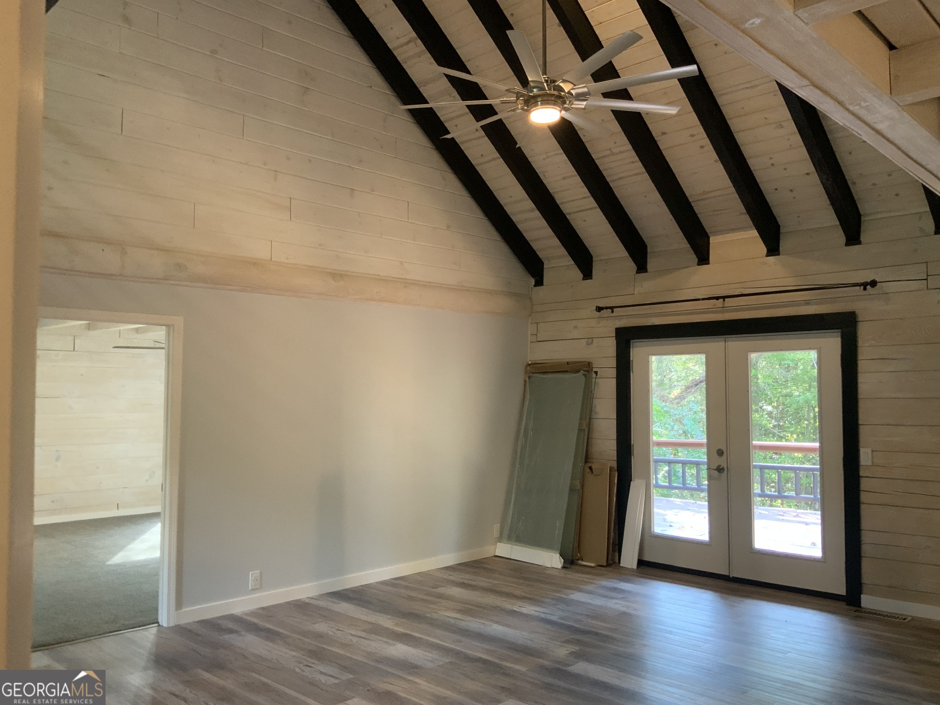 11 Foxfire Road Blairsville, GA 30512 - Photo 37 of 60 a view of an empty room with wooden floor and a window