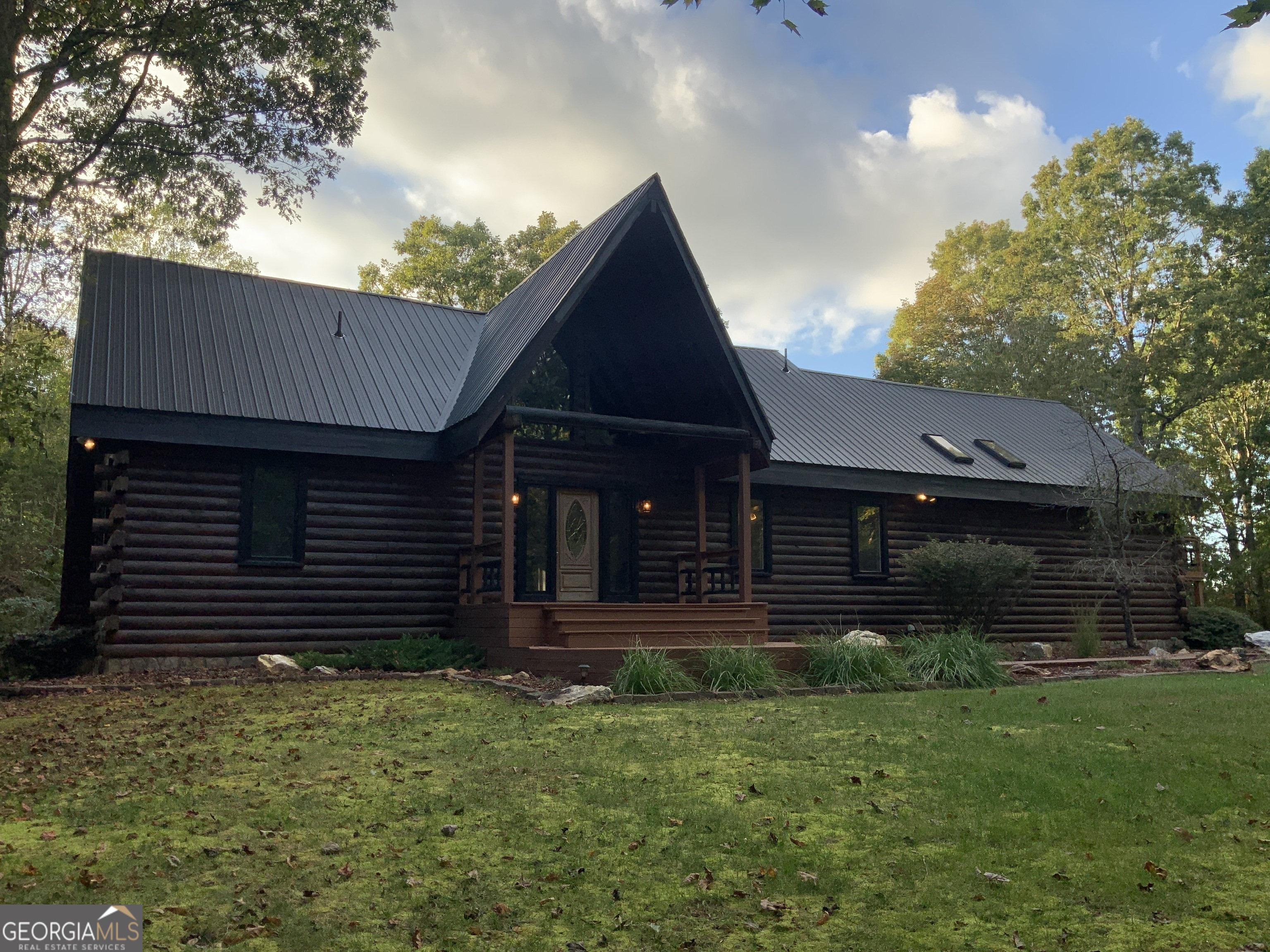 11 Foxfire Road Blairsville, GA 30512 - Photo 5 of 60 a front view of a house with a garden