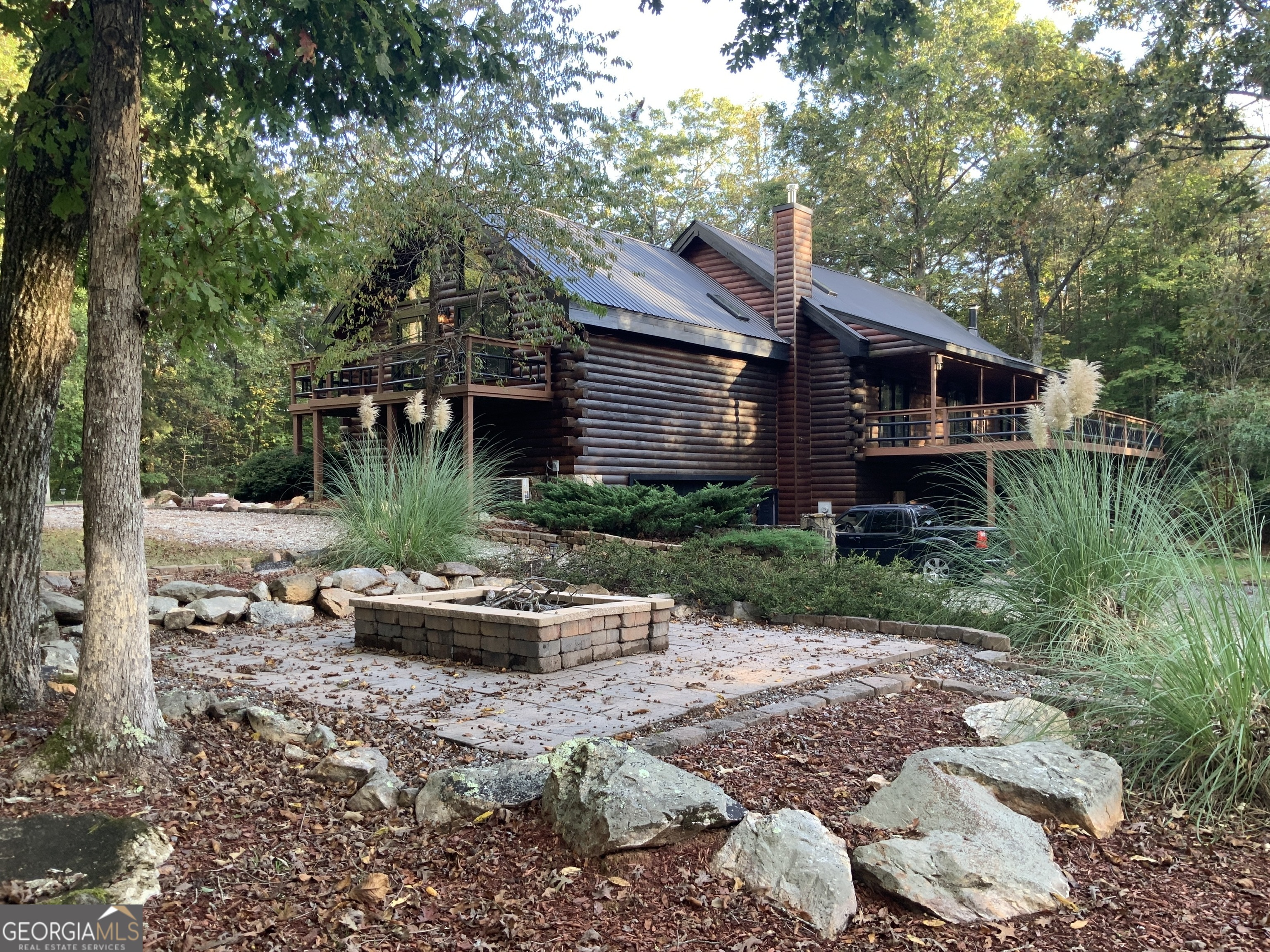 11 Foxfire Road Blairsville, GA 30512 - Photo 7 of 60 a view of a house with a yard and sitting area