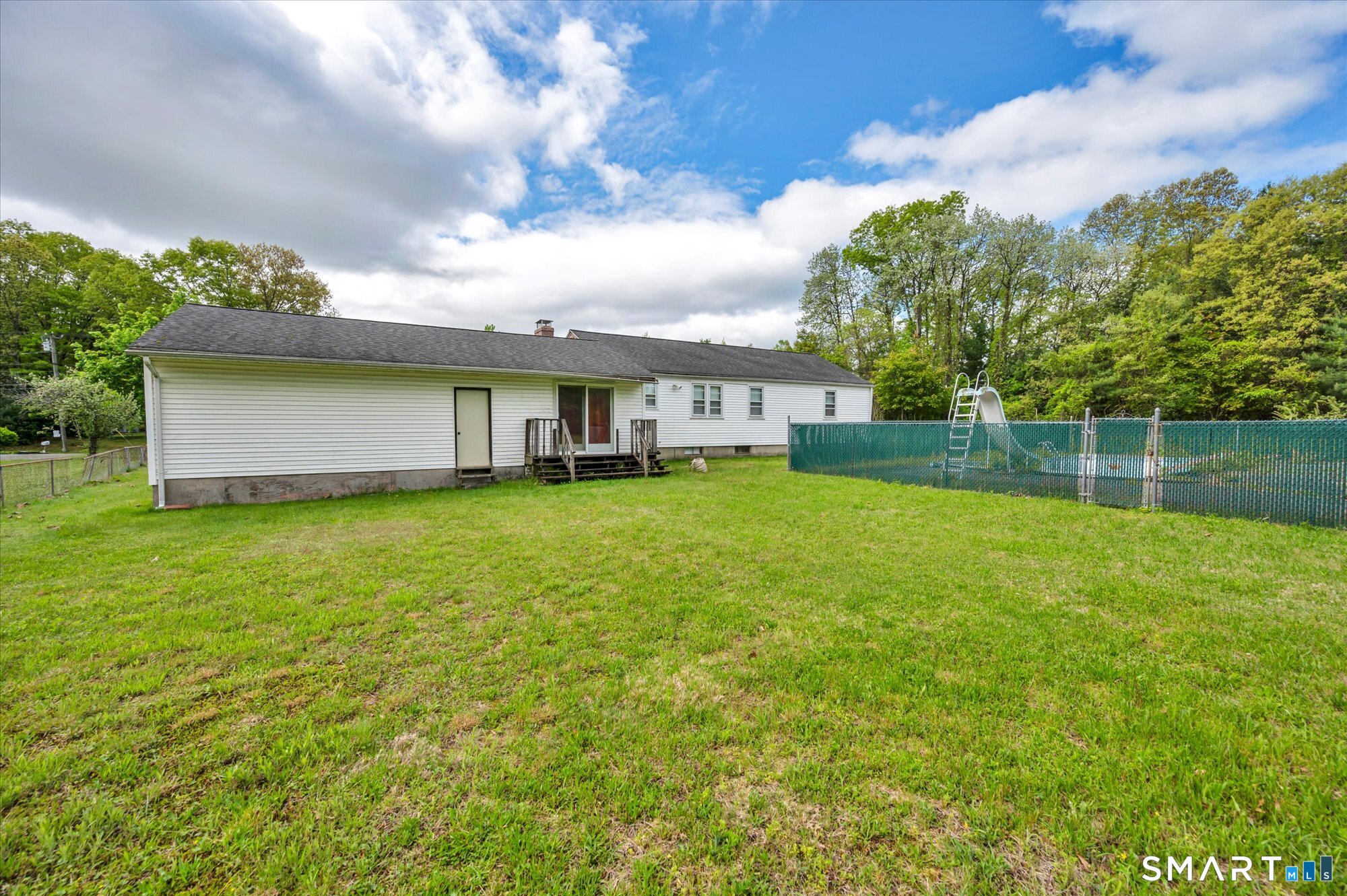 740 Rainbow Road Windsor, CT 06095 - Photo 4 of 40 a front view of a house with garden